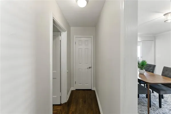 a view of a room that has a table and chairs in it