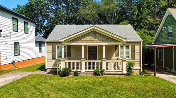 front view of a house with a yard