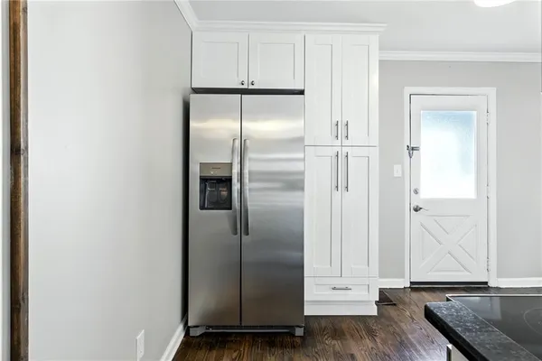 a view of kitchen with wooden floor