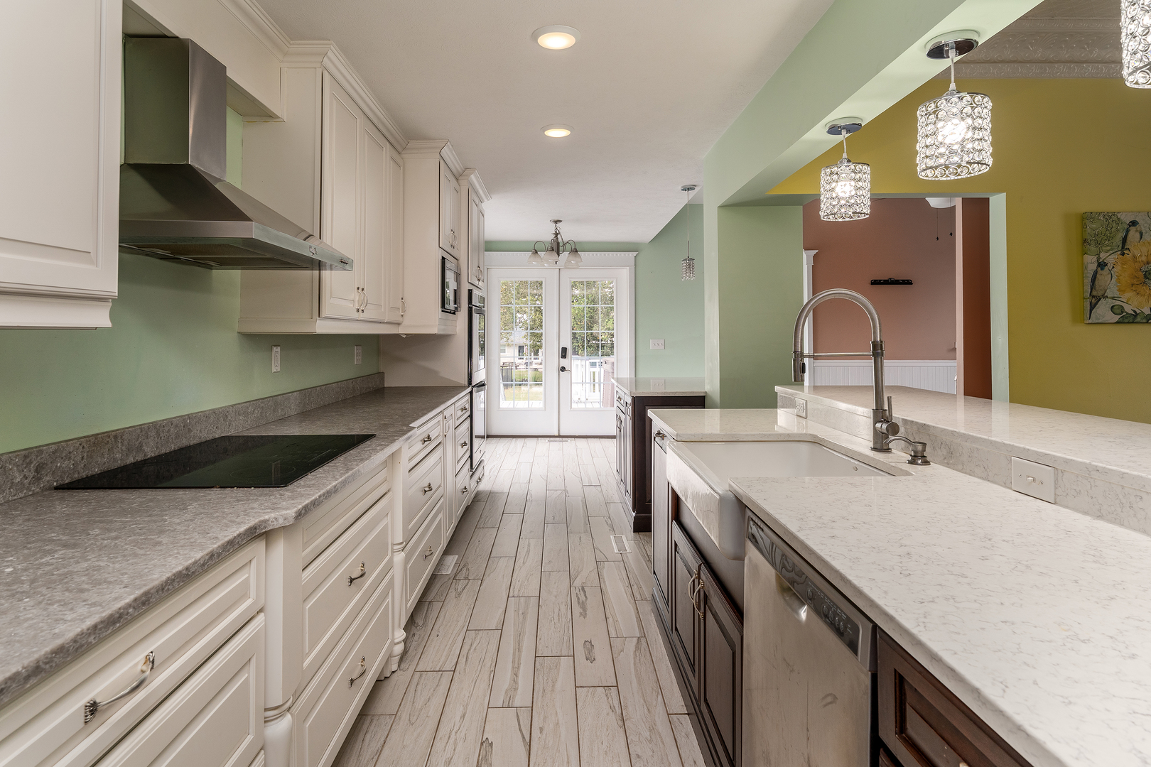 535 East Main Street Du Quoin, IL 62832 - Photo 14 of 75 a large kitchen with stainless steel appliances granite countertop a lot of counter space and wooden floors