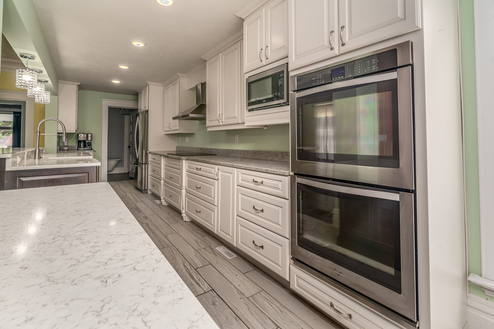 535 East Main Street Du Quoin, IL 62832 - Photo 16 of 75 a kitchen with stainless steel appliances granite countertop a stove microwave and cabinets