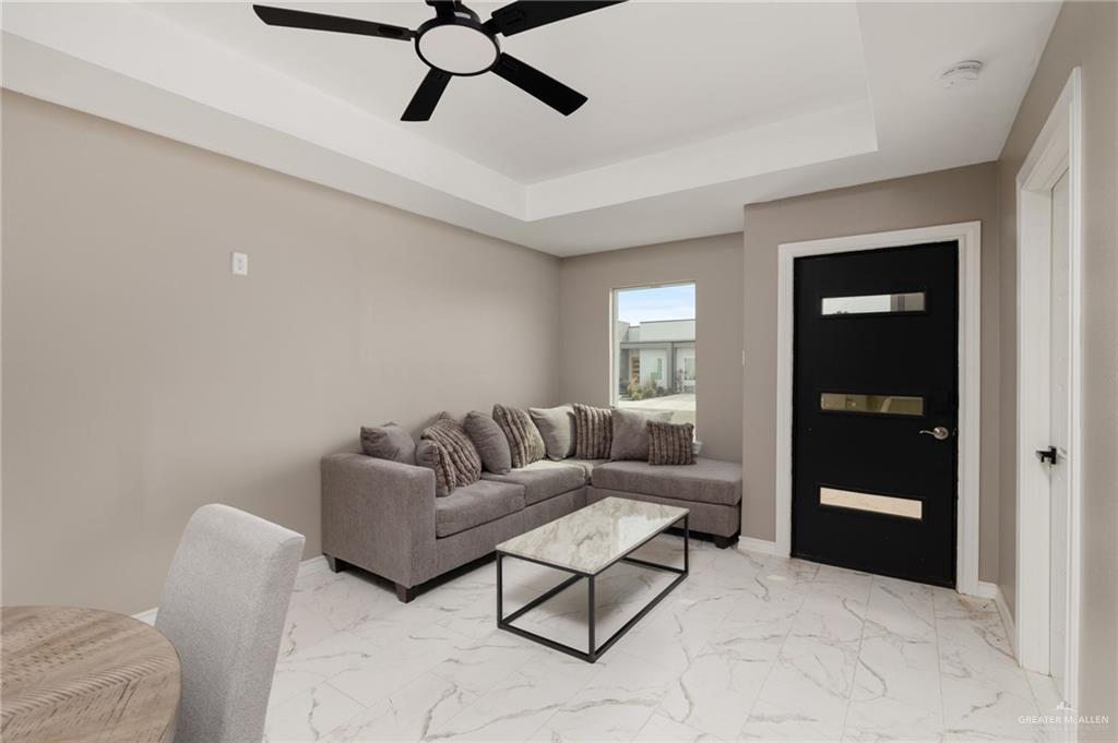 1712 West B Street Mission, TX 78572 - Photo 2 of 11 a living room with furniture and a window