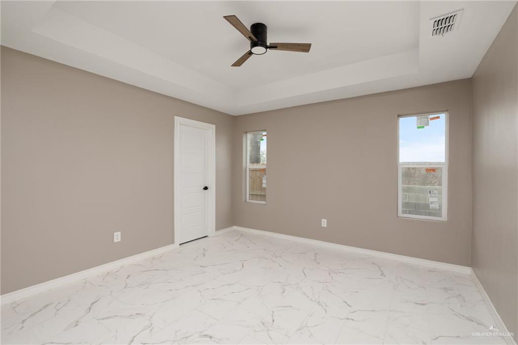 1712 West B Street Mission, TX 78572 - Photo 6 of 11 a view of an empty room with a window