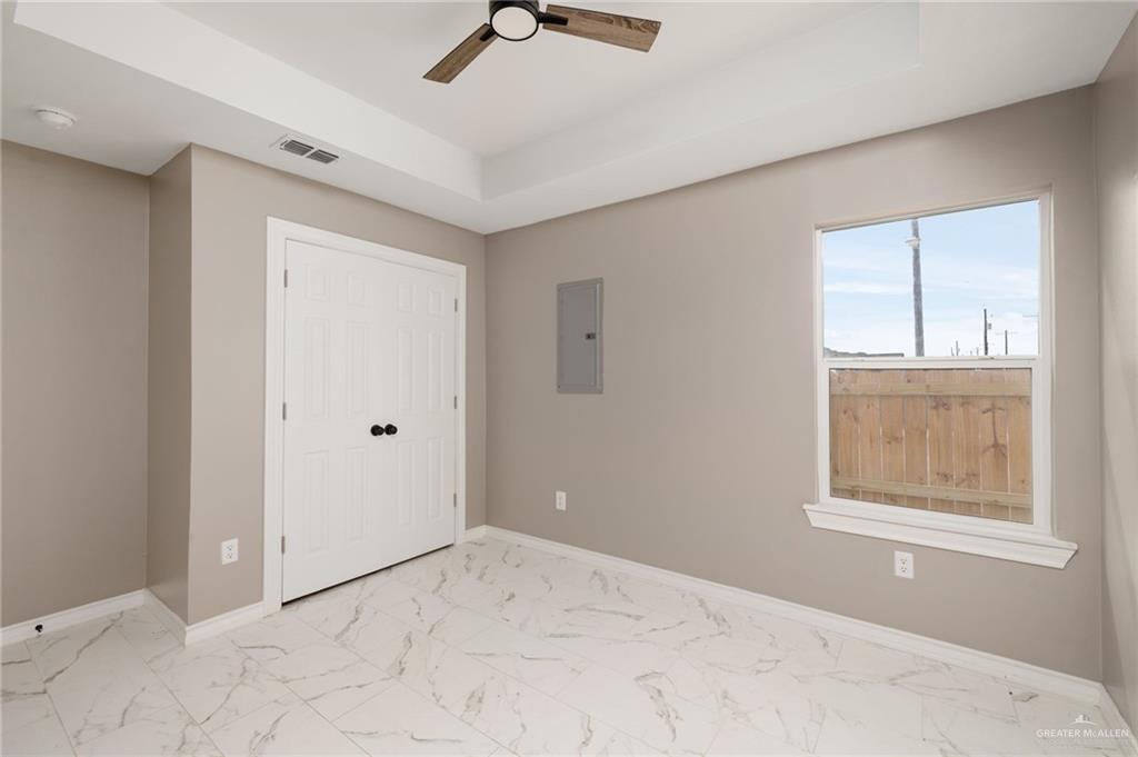1712 West B Street Mission, TX 78572 - Photo 8 of 11 a view of an empty room with a window