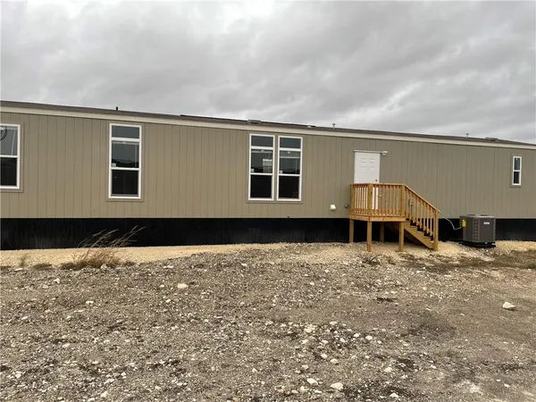 a view of house with yard