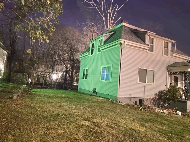 a view of a house with a yard