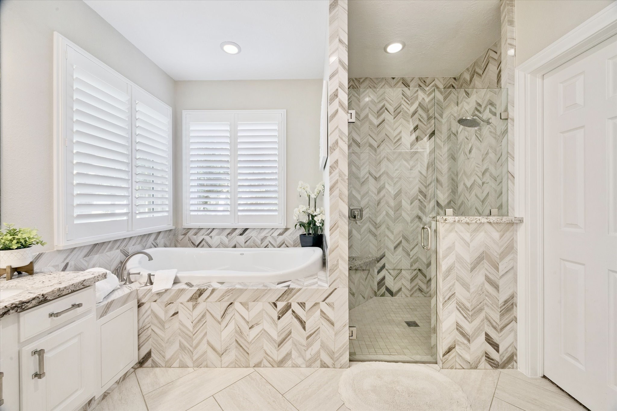 2904 Bridle Path Lane Friendswood, TX 77546 - Photo 26 of 49 It features generous counter space, double sinks, a vanity area, an oversized shower, and even a built-in TV—perfect for catching the morning news while you get ready for the day.