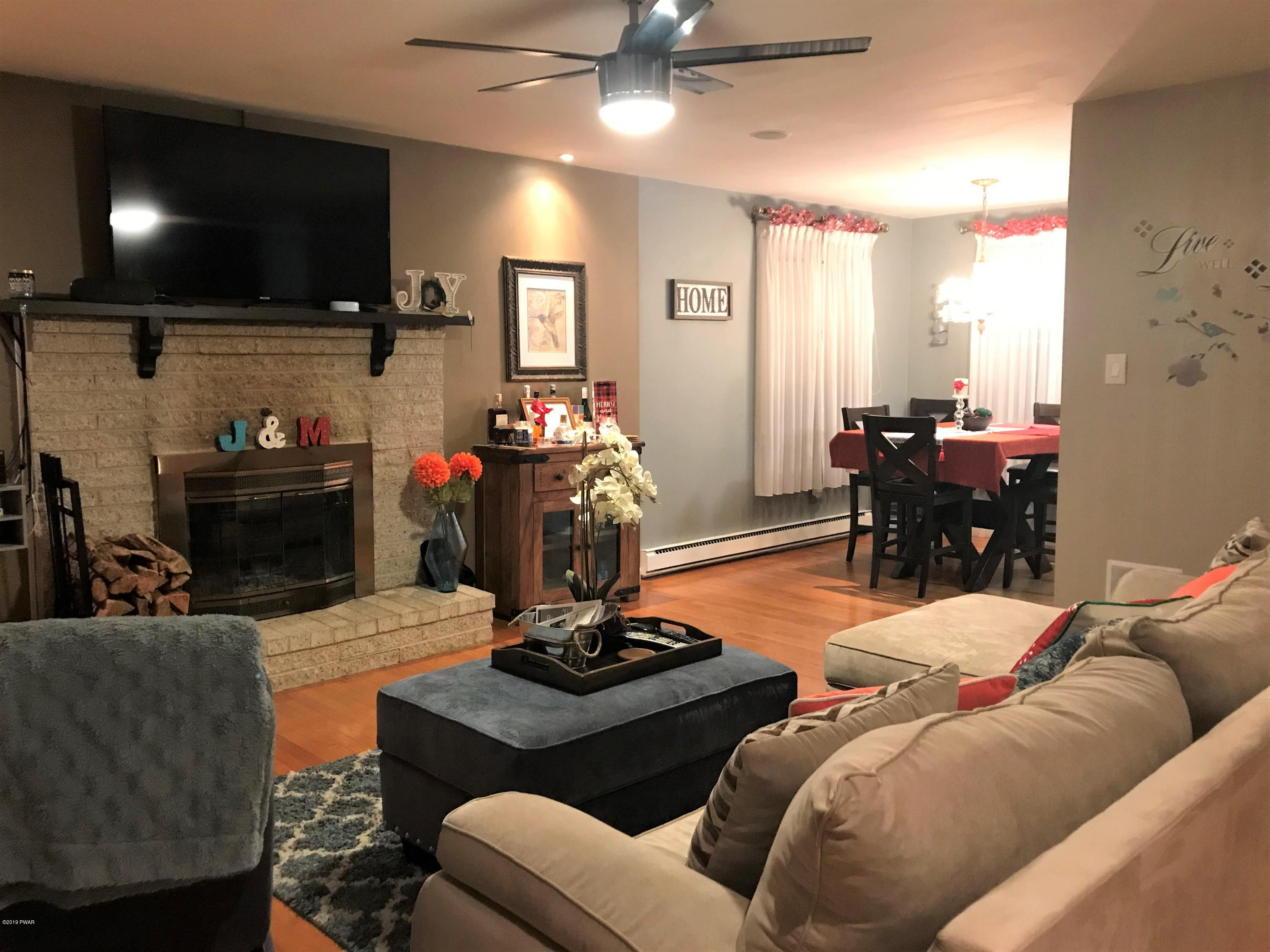 142 Kiel Road Milford, PA 18337 - Photo 4 of 34 a living room with furniture and a flat screen tv