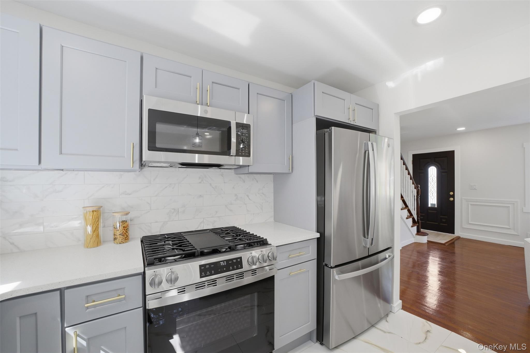 24 Fuller Road Ossining, NY 10562 - Photo 15 of 48 a kitchen with stainless steel appliances granite countertop a stove a refrigerator and a microwave