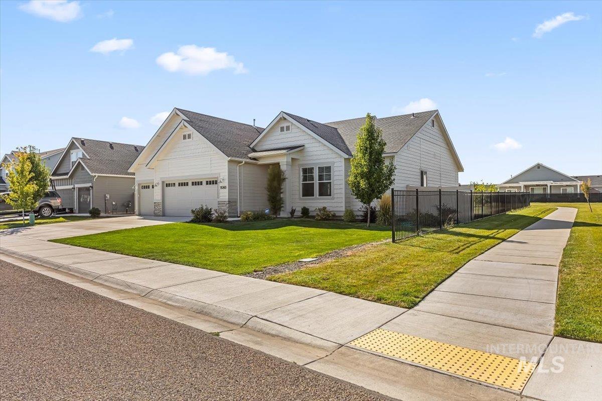15365 Lutsen Avenue Caldwell, ID 83607 - Photo 3 of 42 View of front facade with concrete driveway and a garage