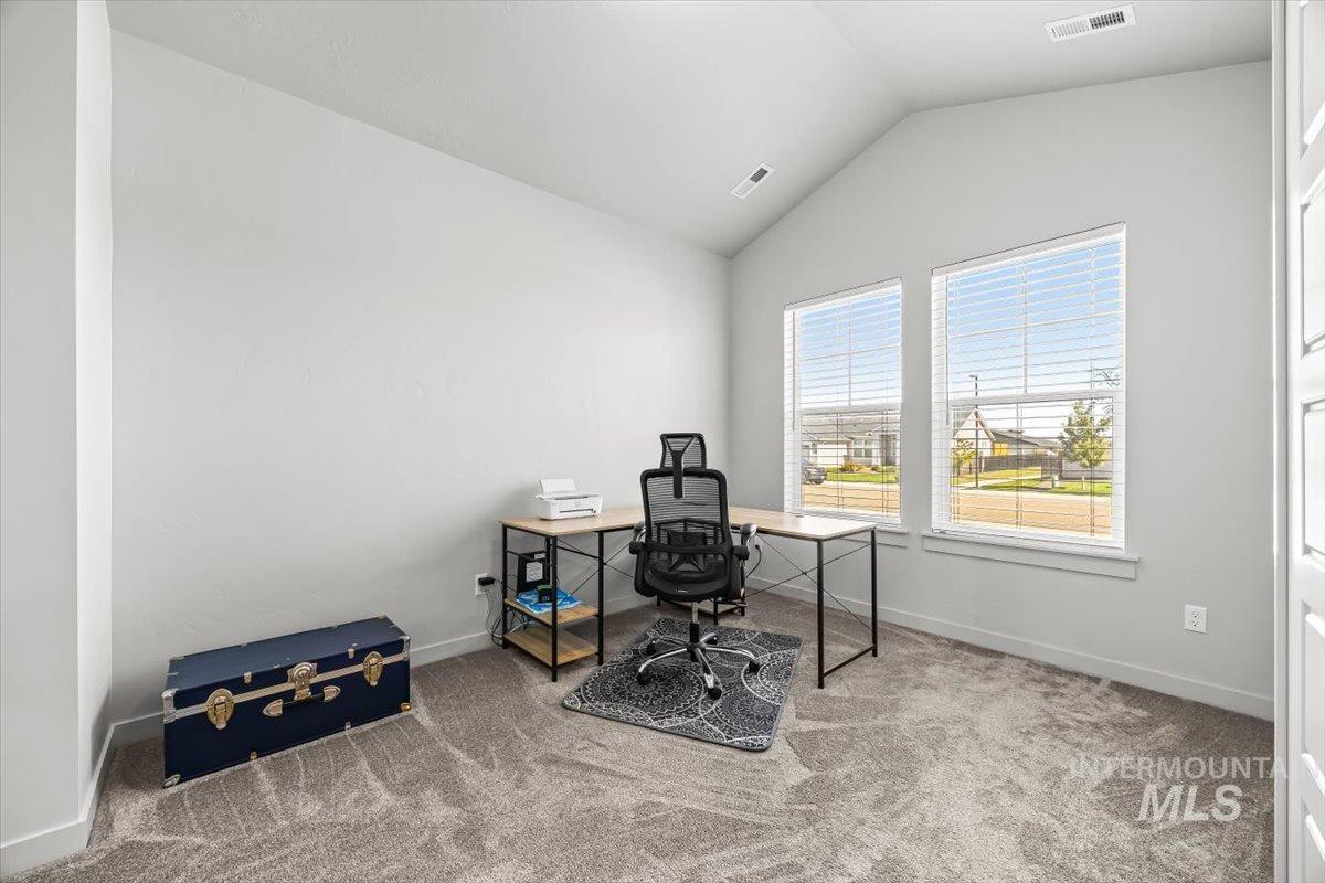 15365 Lutsen Avenue Caldwell, ID 83607 - Photo 7 of 42 Home office featuring vaulted ceiling and carpet flooring