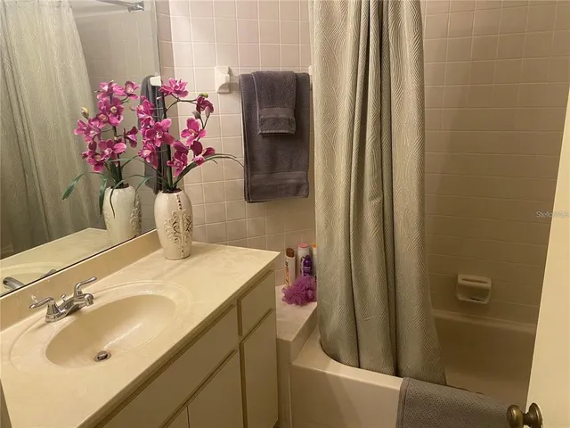 a bathroom with a sink and vanity