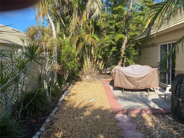 a view of a backyard of the house