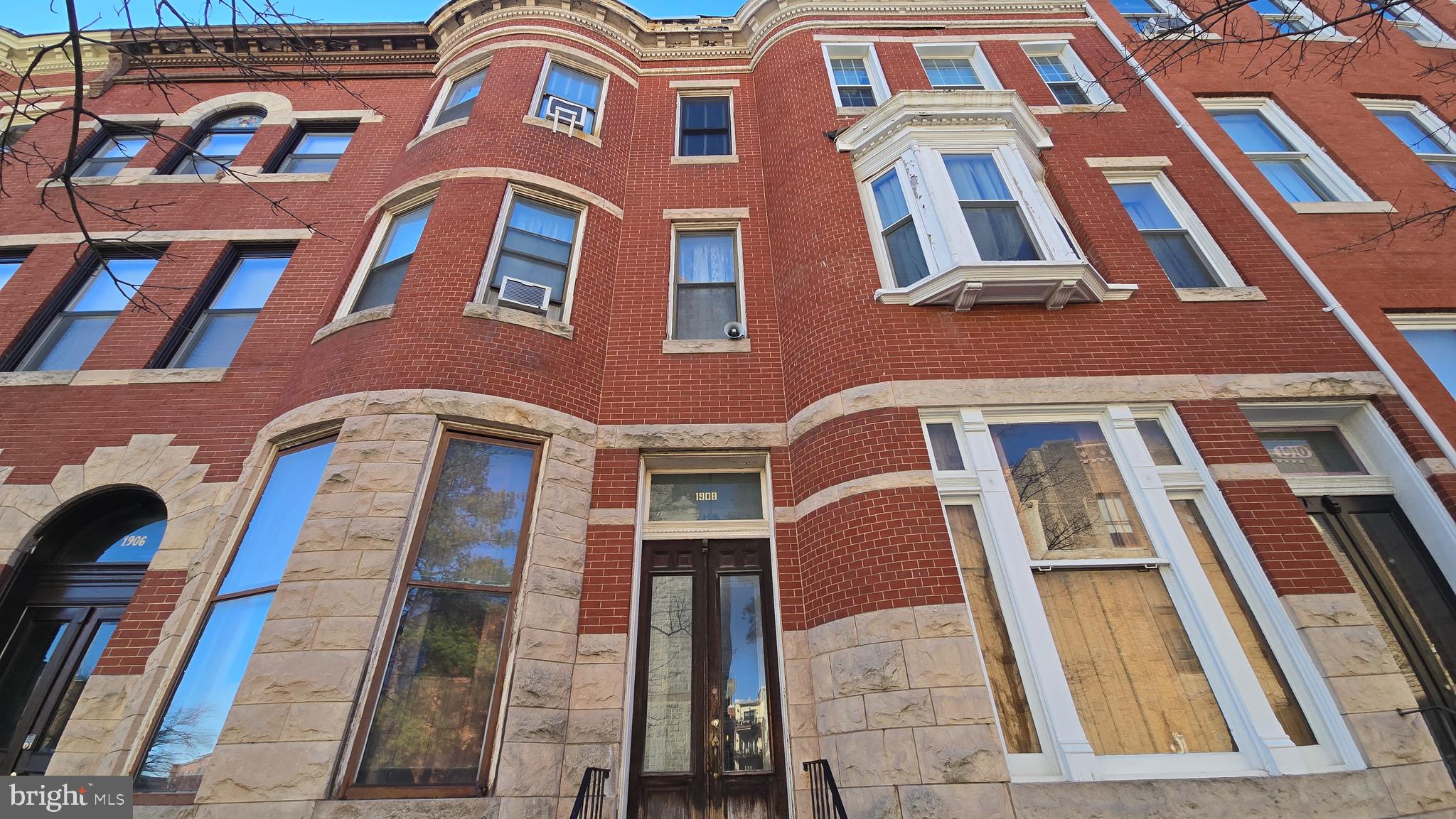 1908 Madison Avenue Baltimore, MD 21217 - Photo 2 of 31 a front view of a multi story residential apartment building
