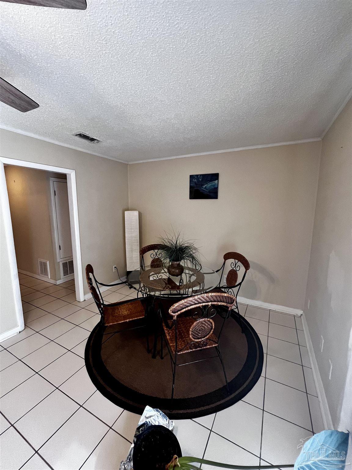 7270 Belgium Road Pensacola, FL 32526 - Photo 2 of 13 a room with a sink and gym equipment