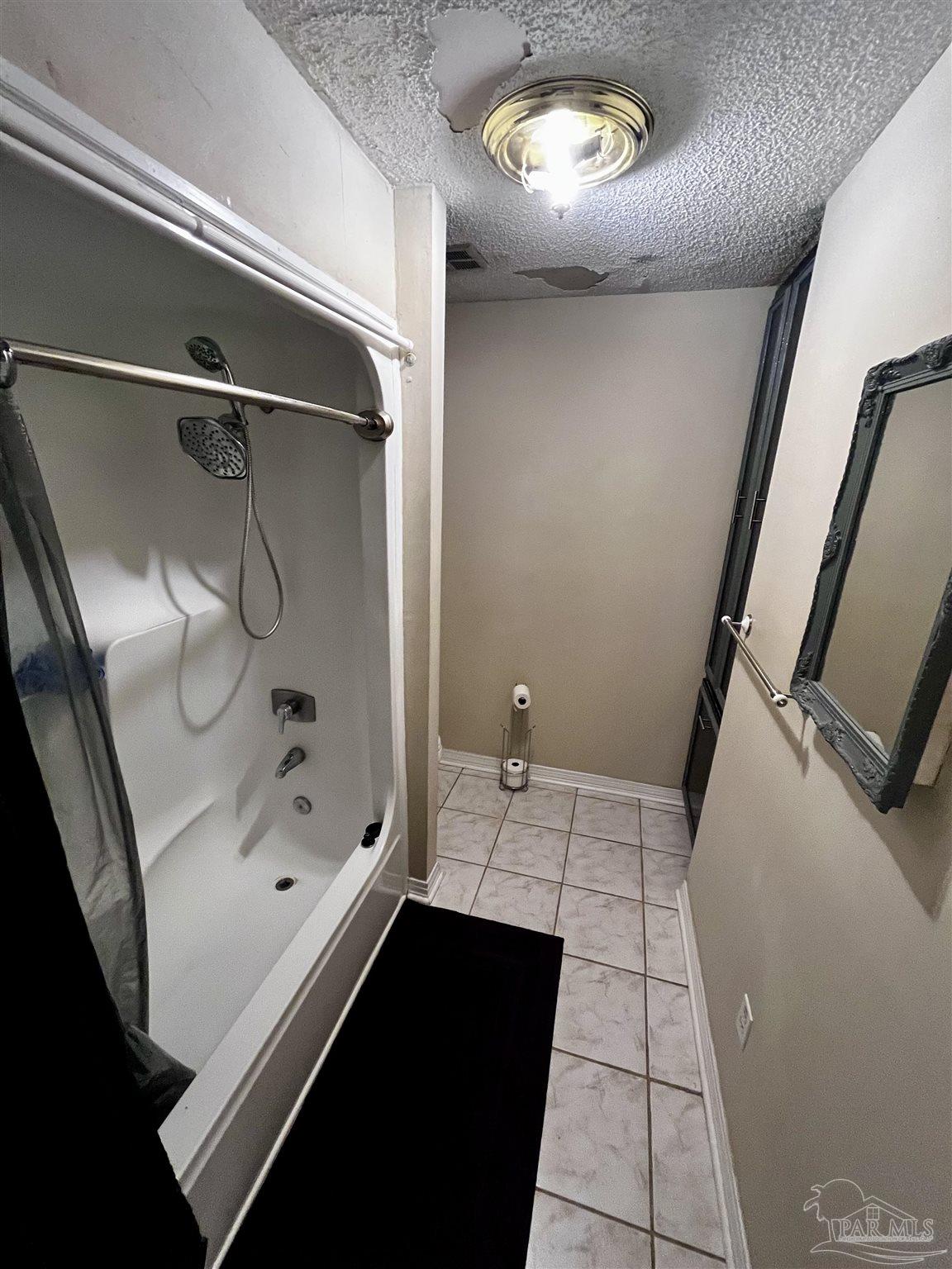 7270 Belgium Road Pensacola, FL 32526 - Photo 5 of 13 a bathroom with a bathtub and a shower