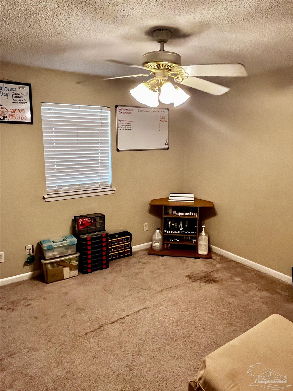 7270 Belgium Road Pensacola, FL 32526 - Photo 8 of 13 a living room with furniture and a chandelier