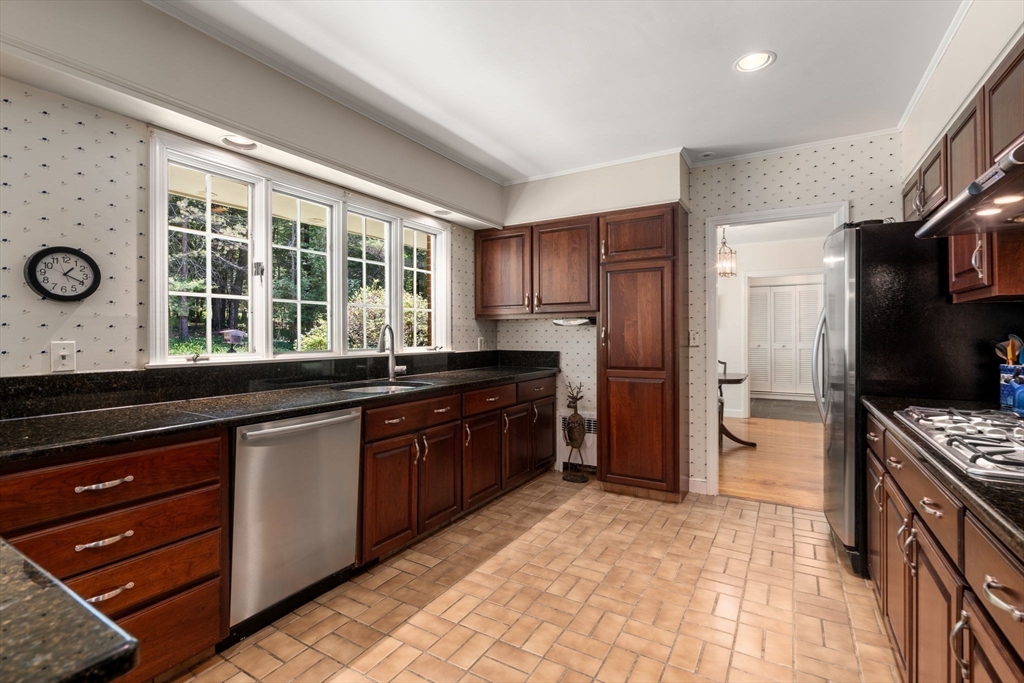 62 Mill Street Sherborn, MA 01770 - Photo 12 of 36 a kitchen with granite countertop a refrigerator and a sink