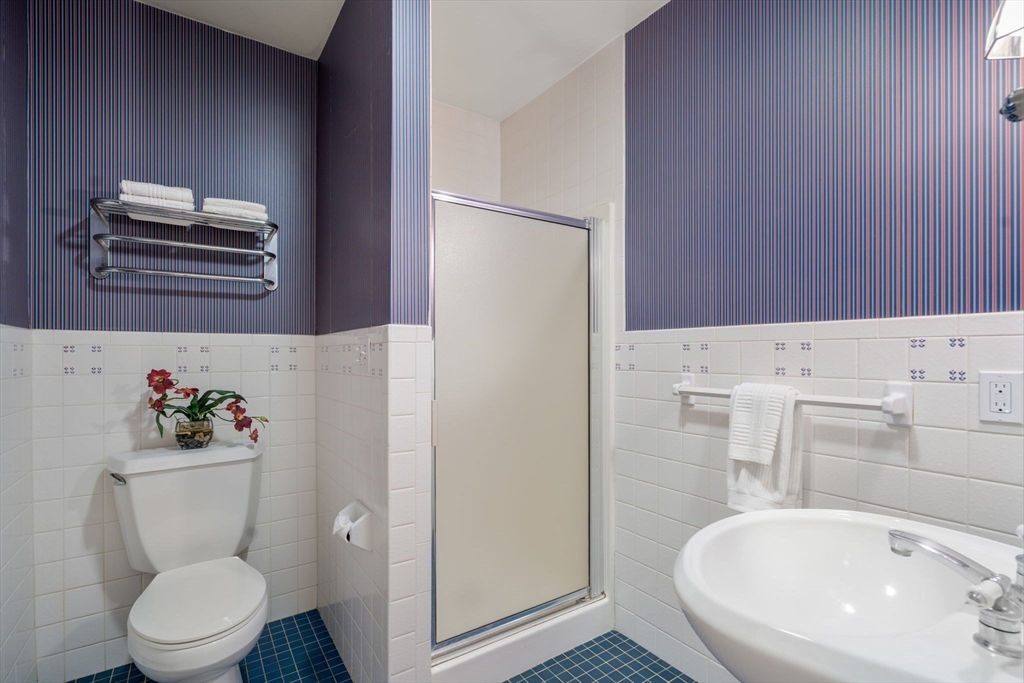 62 Mill Street Sherborn, MA 01770 - Photo 19 of 36 a bathroom with a toilet sink and mirror