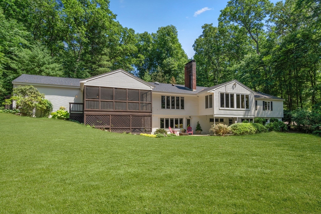 62 Mill Street Sherborn, MA 01770 - Photo 2 of 36 a front view of a house with a garden