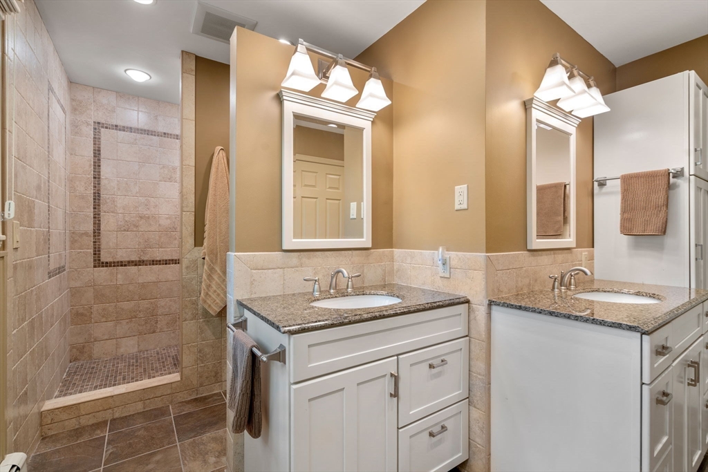 62 Mill Street Sherborn, MA 01770 - Photo 23 of 36 a bathroom with a granite countertop sink and a mirror