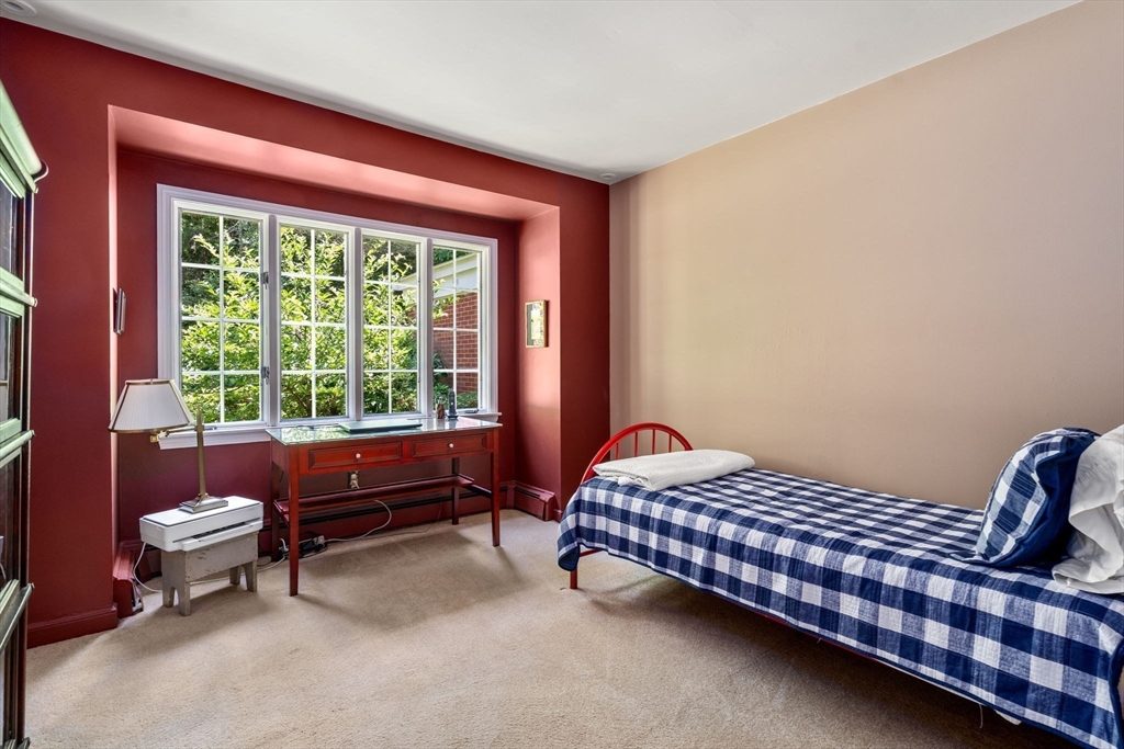 62 Mill Street Sherborn, MA 01770 - Photo 26 of 36 a bedroom with a bed and wooden floor