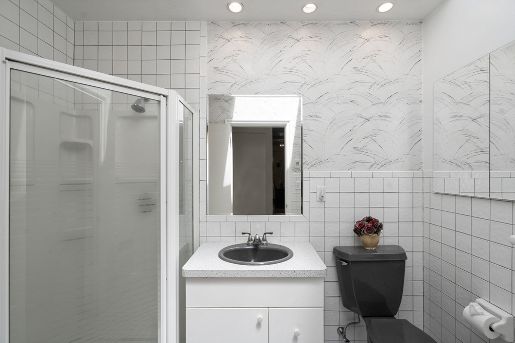 62 Mill Street Sherborn, MA 01770 - Photo 27 of 36 a bathroom with a sink a toilet and shower