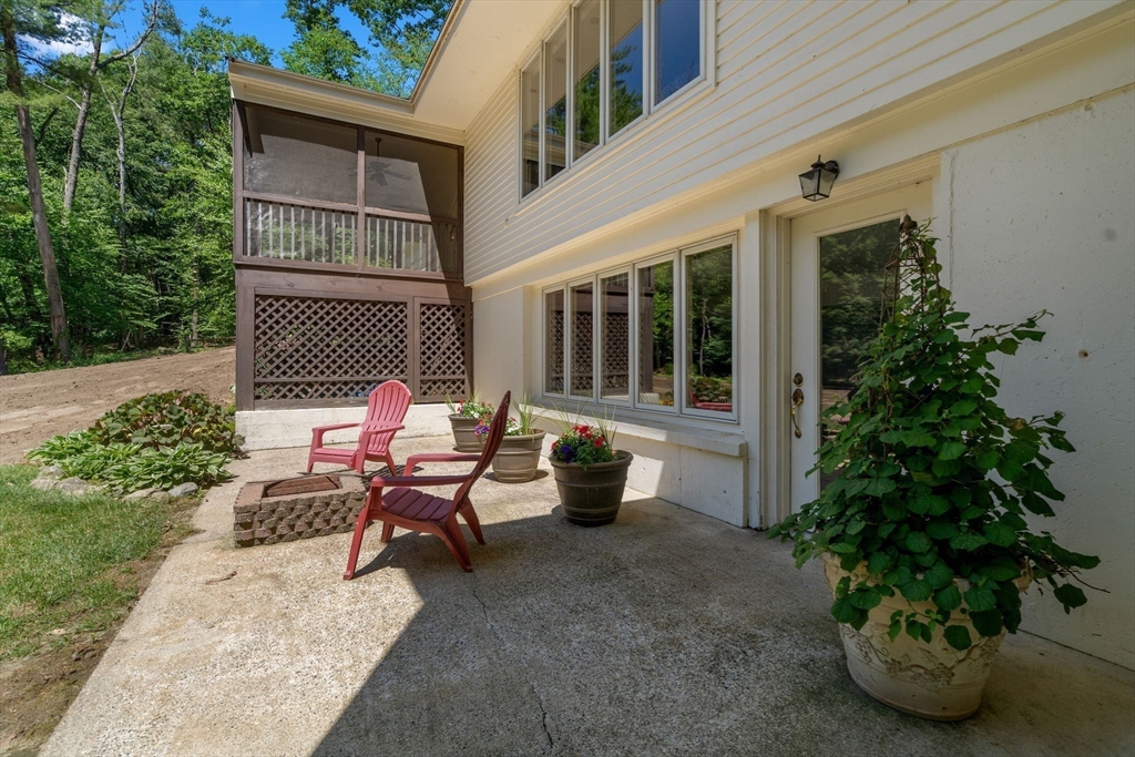 62 Mill Street Sherborn, MA 01770 - Photo 31 of 36 a backyard of a house with outdoor seating