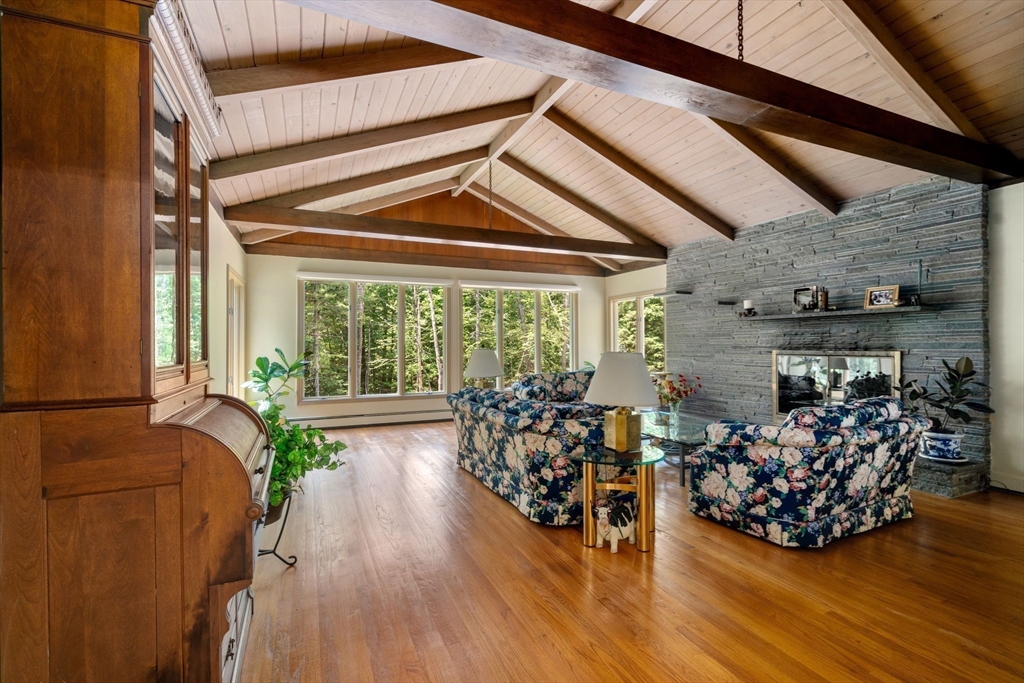 62 Mill Street Sherborn, MA 01770 - Photo 7 of 36 a view of a room with lots of wooden furniture and large windows