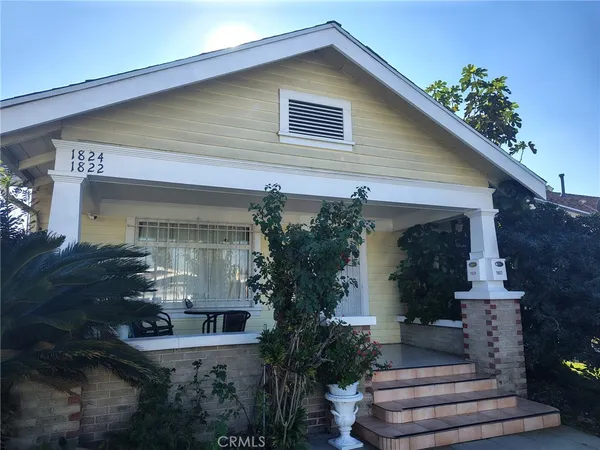 a front view of house along with green space