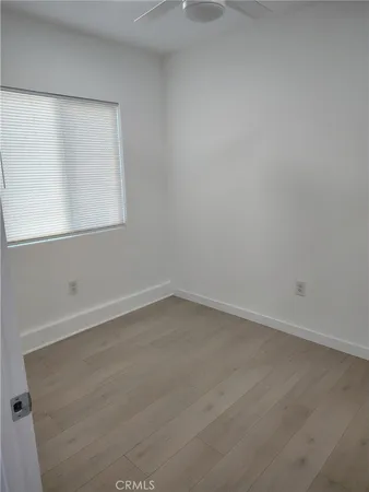 a large kitchen with a stove and a refrigerator