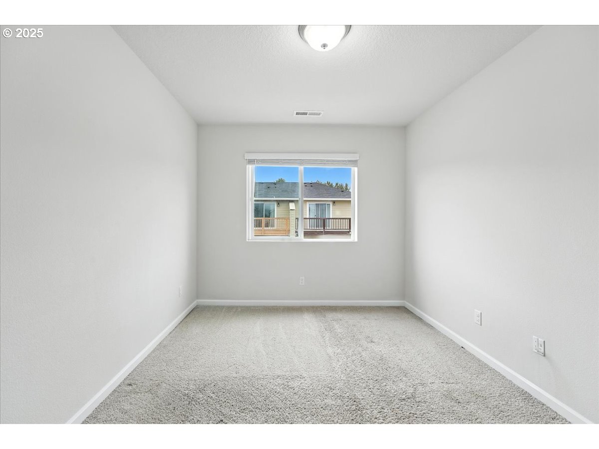 2103 Southeast 18th Alley Gresham, OR 97080 - Photo 14 of 25 an empty room with windows