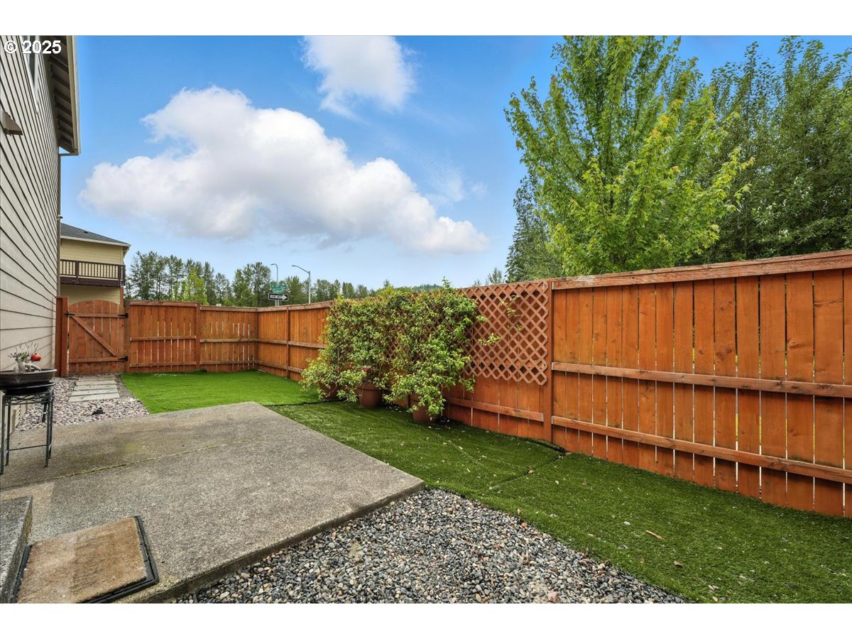 2103 Southeast 18th Alley Gresham, OR 97080 - Photo 15 of 25 a view of a backyard with a garden