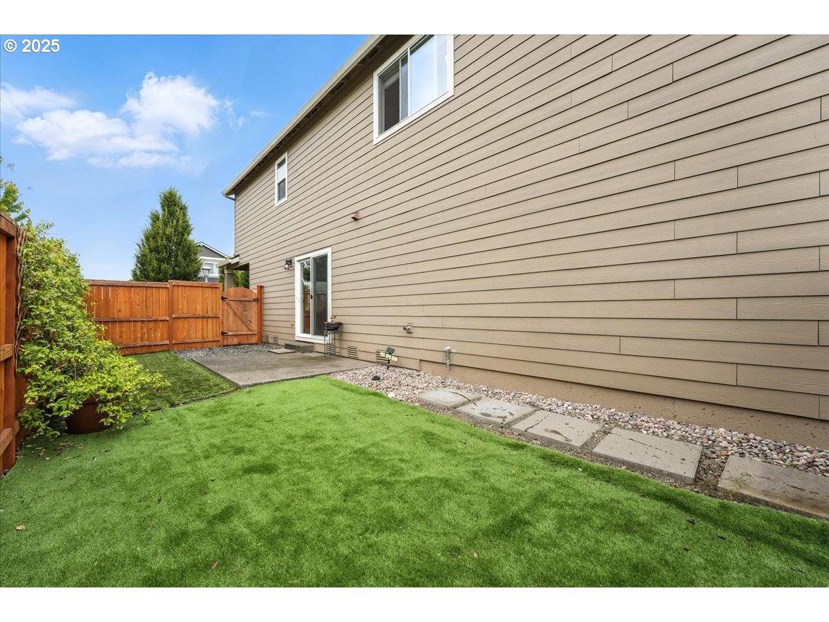 2103 Southeast 18th Alley Gresham, OR 97080 - Photo 16 of 25 a backyard of a house with lots of green space