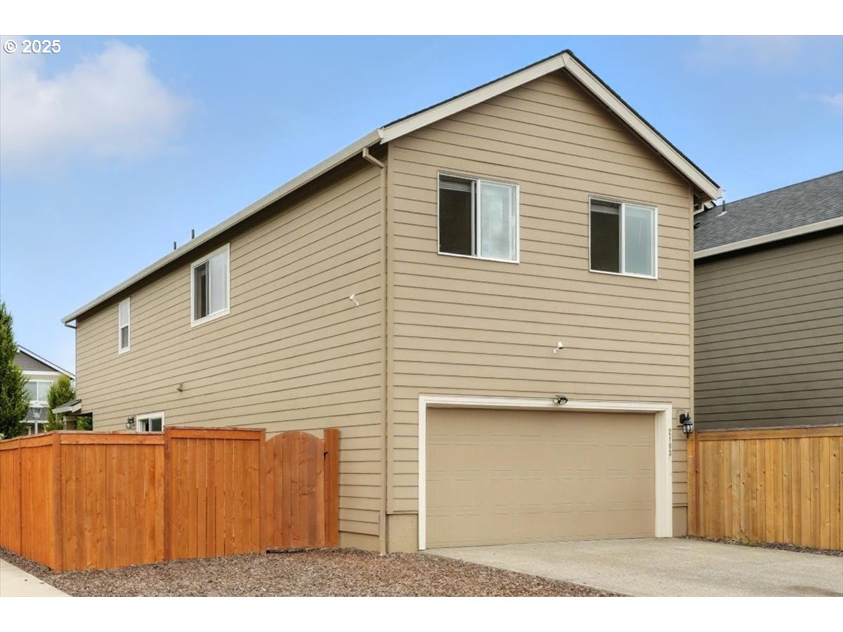 2103 Southeast 18th Alley Gresham, OR 97080 - Photo 17 of 25 a view of a house with a yard