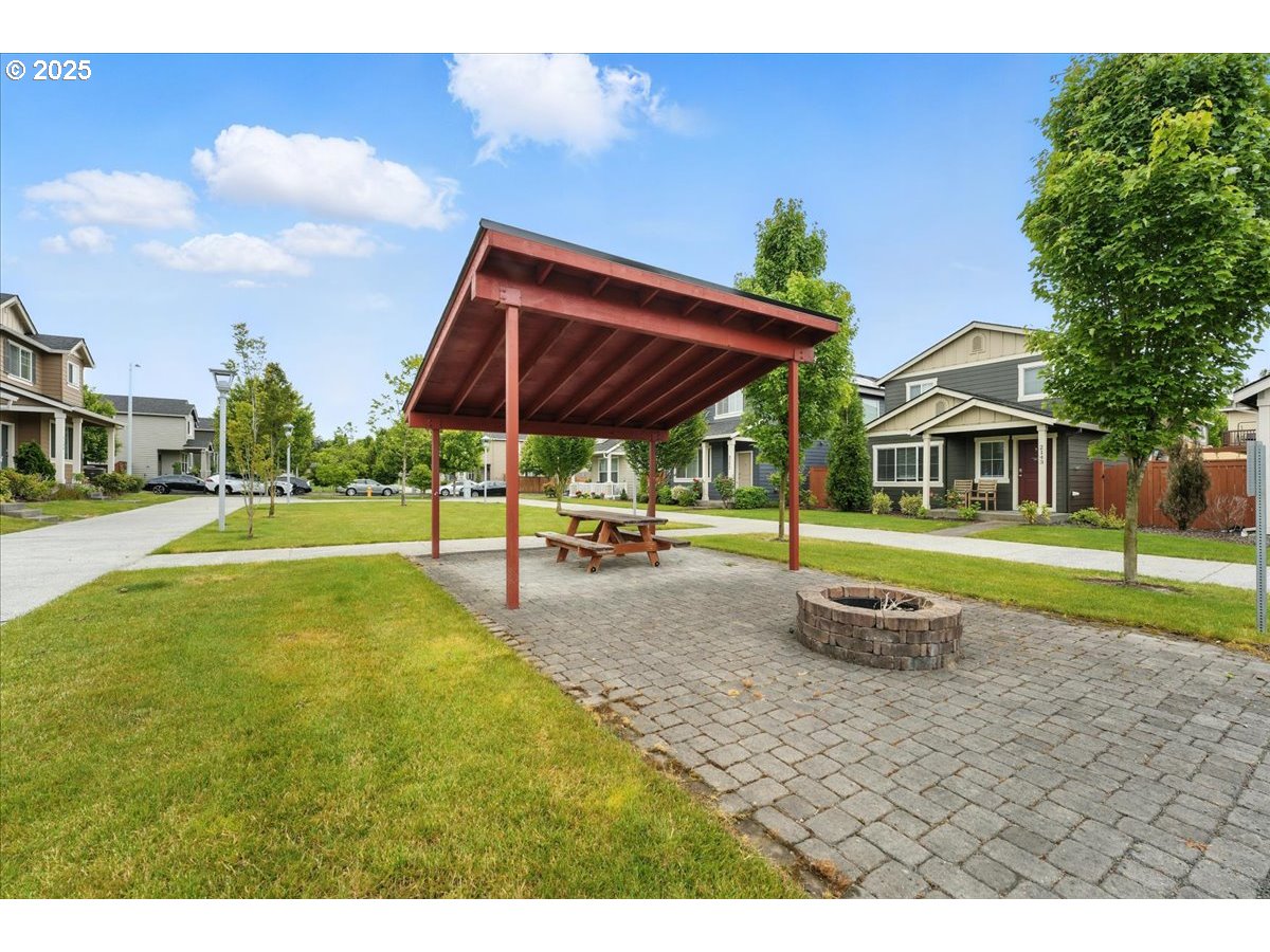 2103 Southeast 18th Alley Gresham, OR 97080 - Photo 19 of 25 a view of a house with a yard