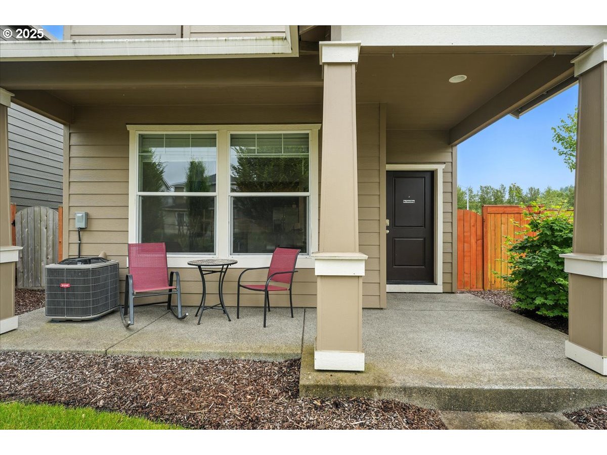 2103 Southeast 18th Alley Gresham, OR 97080 - Photo 2 of 25 a dining area with a table and chairs