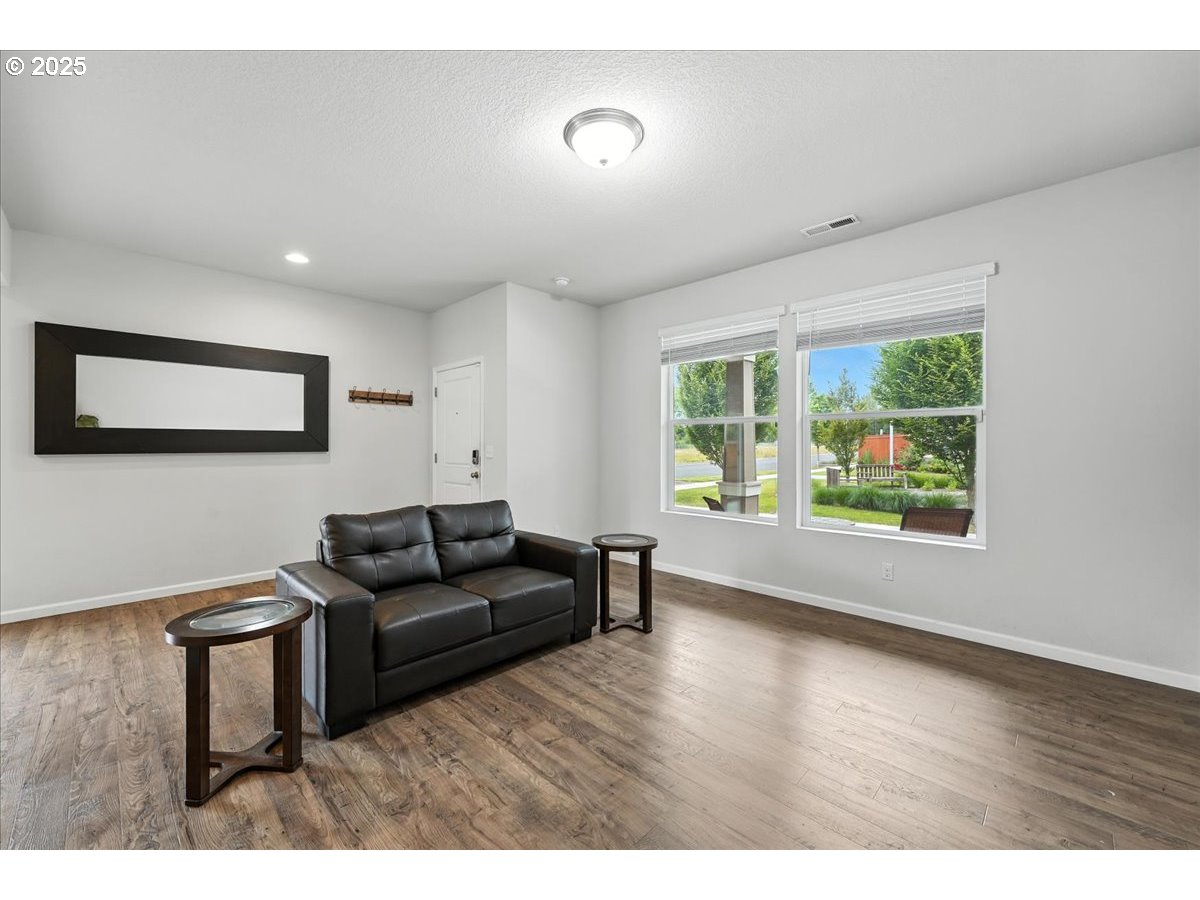 2103 Southeast 18th Alley Gresham, OR 97080 - Photo 4 of 25 a living room with furniture and a window