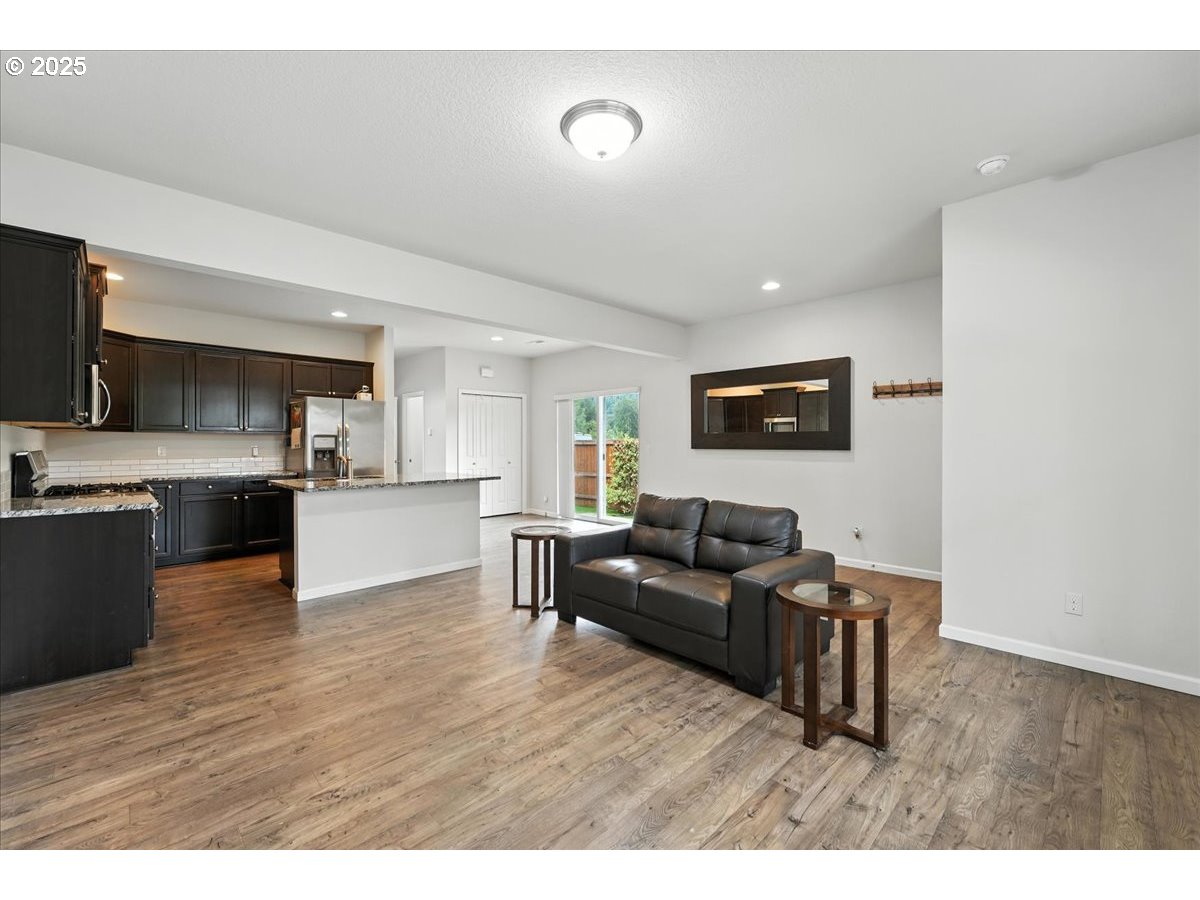 2103 Southeast 18th Alley Gresham, OR 97080 - Photo 5 of 25 a living room with furniture and a flat screen tv