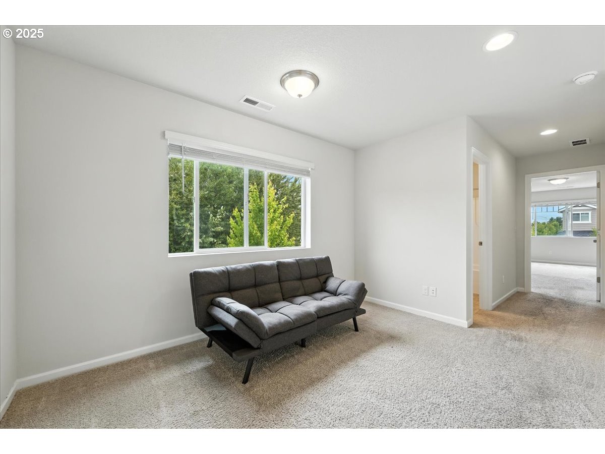 2103 Southeast 18th Alley Gresham, OR 97080 - Photo 7 of 25 a living room with furniture and a window