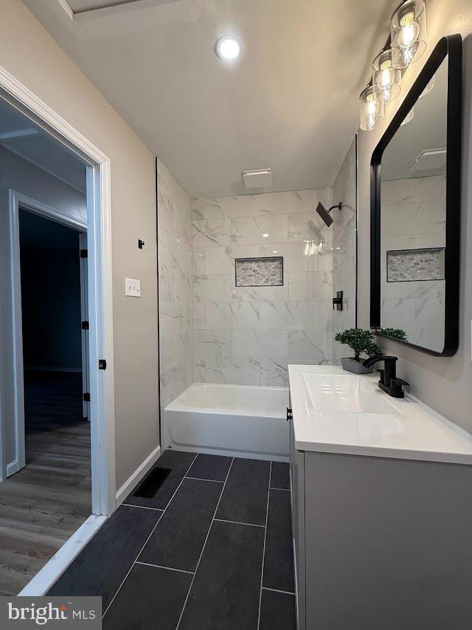 7 Ridgewood Road Gibbsboro, NJ 08026 - Photo 17 of 33 a bathroom with a bathtub a sink and a mirror