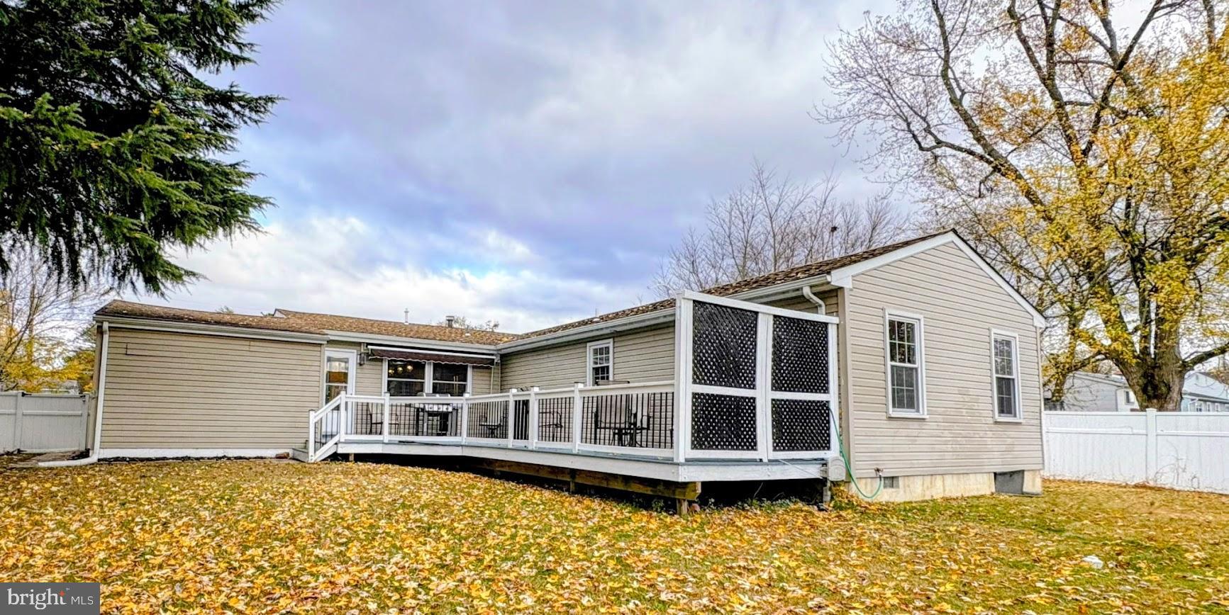 7 Ridgewood Road Gibbsboro, NJ 08026 - Photo 9 of 33 a view of a house with a large window and wooden fence