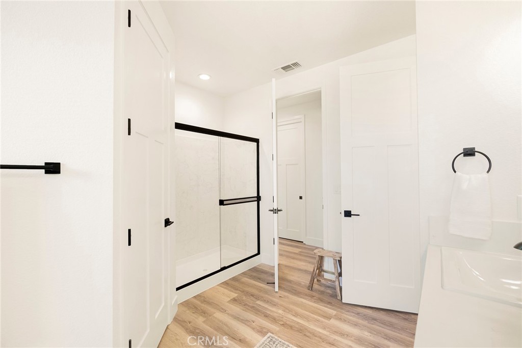 22 Harkness Court Chico, CA 95973 - Photo 21 of 49 a bathroom with a shower and a glass door