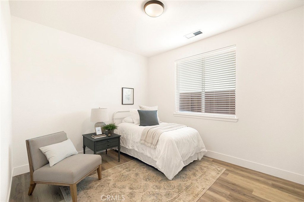 22 Harkness Court Chico, CA 95973 - Photo 29 of 49 a bedroom with a bed and chair