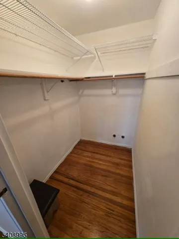 a view of wooden floor and chair in a room