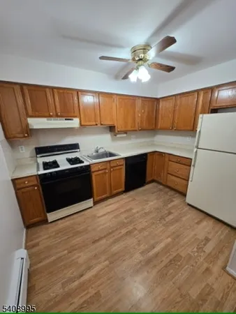 a view of kitchen and wooden floor