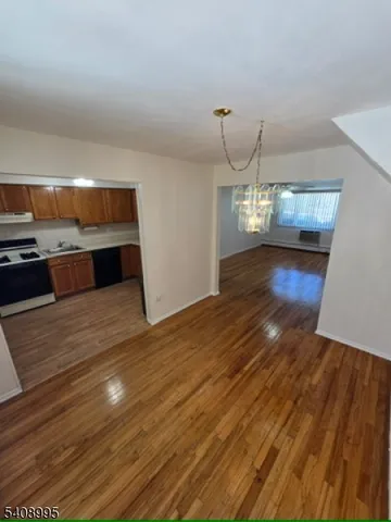 a kitchen with cabinets a sink and appliances