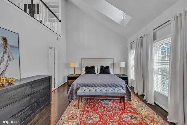 a view of a livingroom with furniture and staircase