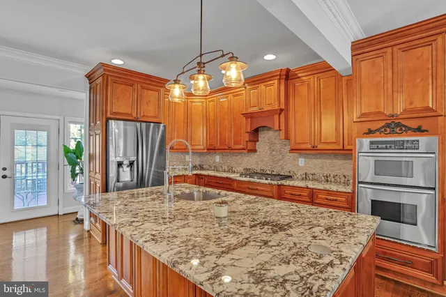 a dining hall with couches a dining table and chairs