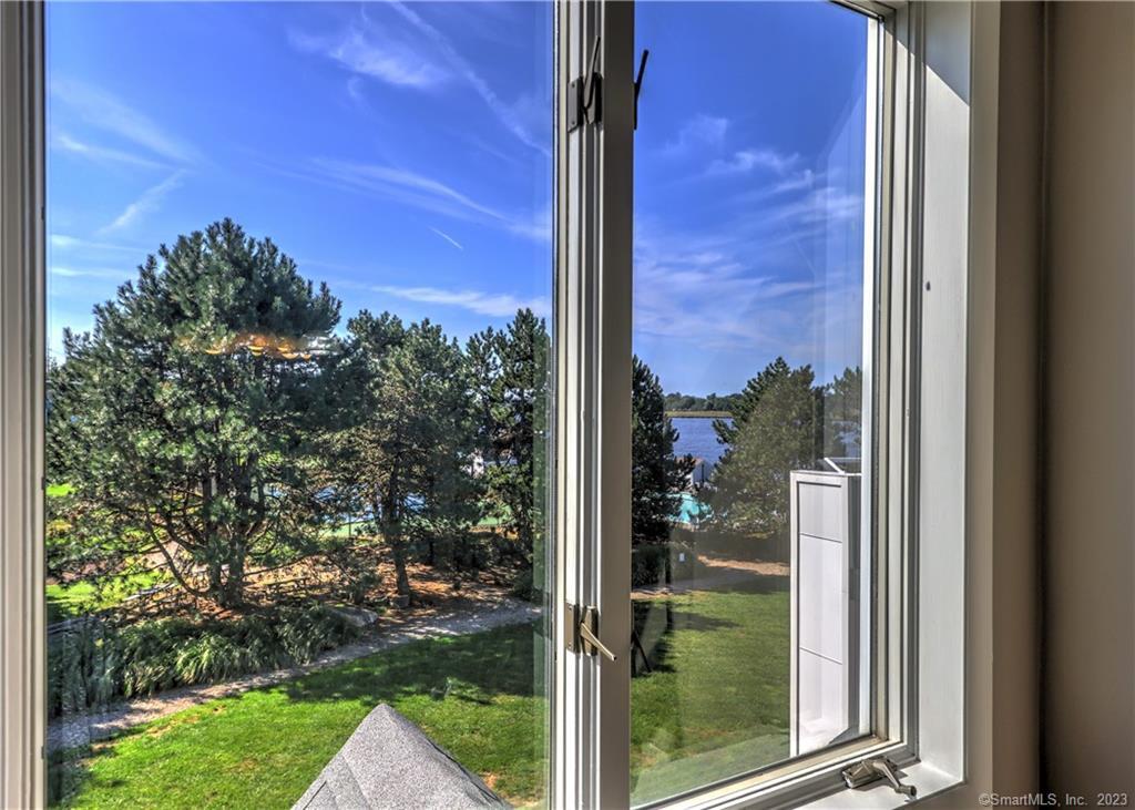 835 Popes Island Road, Unit 835 Milford, CT 06461 - Photo 1 of 1 a view of a door and a tree
